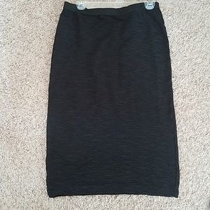 Not your average black textured pencil skirt.